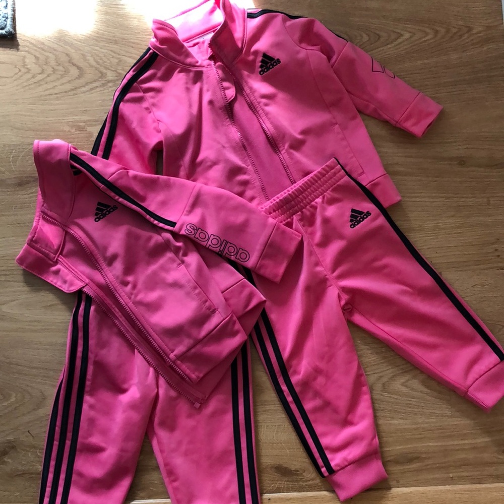 Two adidas tracksuits for girls